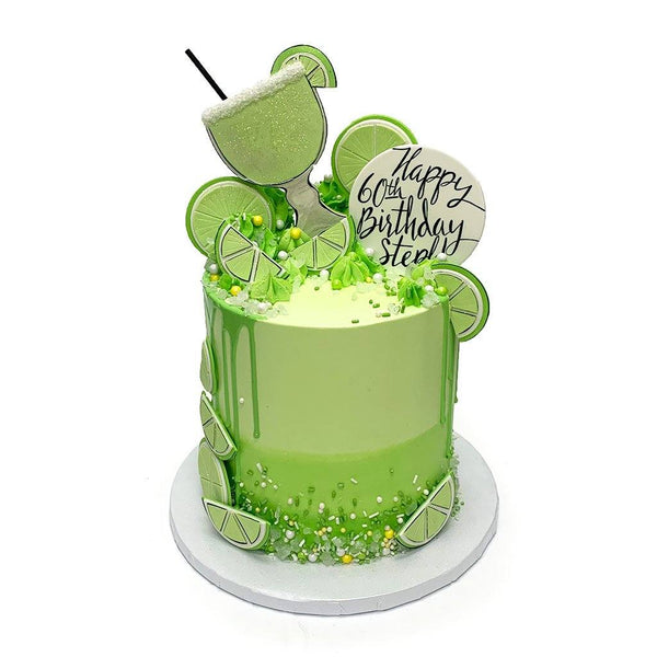 Green birthday cake with rice paper decorations – Cambridge Fancy Cakes